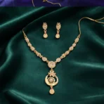 Stylish Gold-Tone Circular Pendant Necklace Set with Floral Accent & Matching Earrings - Image 2